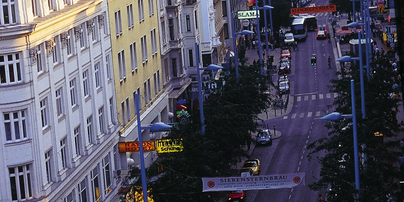 Tower of Stiftskirche Church on Mariahilfer Strasse Street in Vienna